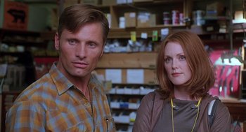 Movie still from “Psycho” (1998), directed by Gus Van Sant – A man and a woman standing next to each other; Close Up shot, Low angle