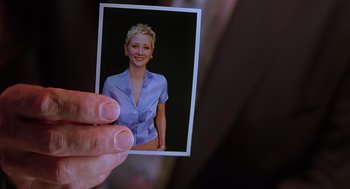 Movie still from “Psycho” (1998), directed by Gus Van Sant – A person holding a picture of a woman; Extreme Close Up shot, High angle