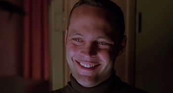 Movie still from “Psycho” (1998), directed by Gus Van Sant – A man smiling with his eyes closed; Close Up shot, Low angle