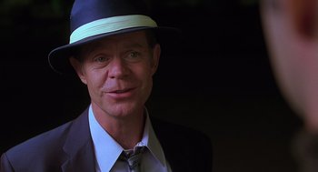 Movie still from “Psycho” (1998), directed by Gus Van Sant – A person wearing a suit and a hat; Close Up shot, Over the shoulder angle