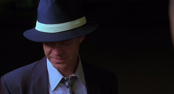 Movie still from “Psycho” (1998), directed by Gus Van Sant – A man wearing a suit and a hat; Close Up shot, Low angle