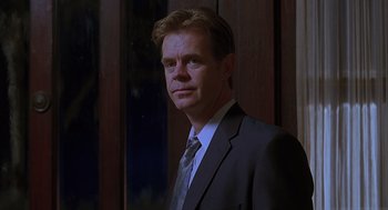 Movie still from “Psycho” (1998), directed by Gus Van Sant – A person wearing a suit and tie; Close Up shot, Low angle