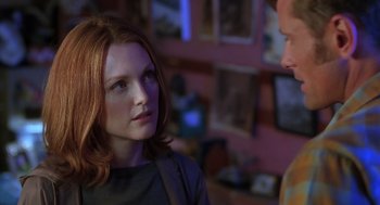 Movie still from “Psycho” (1998), directed by Gus Van Sant – A woman with red hair is looking at a man in a room; Close Up shot, Over the shoulder angle