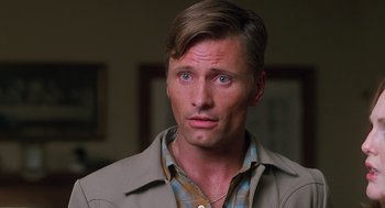 Movie still from “Psycho” (1998), directed by Gus Van Sant – A person wearing a shirt and a jacket; Close Up shot, High angle