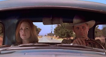 Movie still from “Psycho” (1998), directed by Gus Van Sant – A man and a woman in the back seat of a car; Medium shot, Low angle