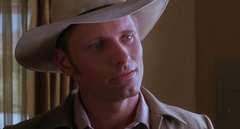Movie still from “Psycho” (1998), directed by Gus Van Sant – A person wearing a cowboy hat; Close Up shot, Low angle