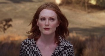 Movie still from “Psycho” (1998), directed by Gus Van Sant – A person wearing a checkered shirt; Close Up shot, Low angle