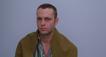 Movie still from “Psycho” (1998), directed by Gus Van Sant – A person wearing a shirt and jacket; Close Up shot, Low angle