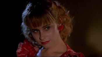 Movie still from “Psycho IV: The Beginning” (1990), directed by Mick Garris – A person wearing a red dress; Close Up shot, Over the shoulder angle