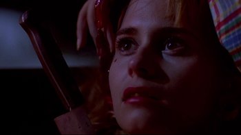 Movie still from “Psycho IV: The Beginning” (1990), directed by Mick Garris – A woman with a phone in her hand; Close Up shot, Low angle