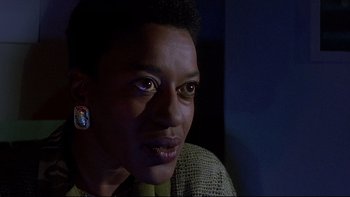 Movie still from “Psycho IV: The Beginning” (1990), directed by Mick Garris – A person wearing a green shirt; Close Up shot, Low angle