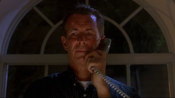 Movie still from “Psycho IV: The Beginning” (1990), directed by Mick Garris – A person talking on a phone; Close Up shot, Low angle