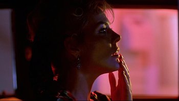 Movie still from “Psycho IV: The Beginning” (1990), directed by Mick Garris – A woman with her hand over her mouth; Close Up shot, Low angle