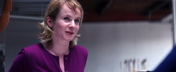 Movie still from “Punch-Drunk Love” (2002), directed by Paul Thomas Anderson – A person wearing a purple shirt; Close Up shot, Over the shoulder angle