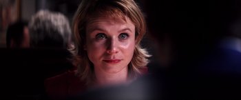 Movie still from “Punch-Drunk Love” (2002), directed by Paul Thomas Anderson – A person looking at the camera; Close Up shot, Over the shoulder angle