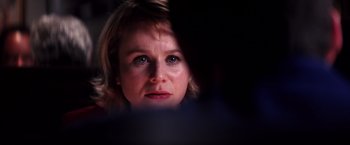 Movie still from “Punch-Drunk Love” (2002), directed by Paul Thomas Anderson – A woman's face in the dark; Close Up shot, Over the shoulder angle