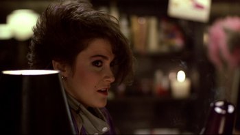 Movie still from “Purple Rain” (1984), directed by Albert Magnoli – A person sitting in front of a computer; Close Up shot, Over the shoulder angle