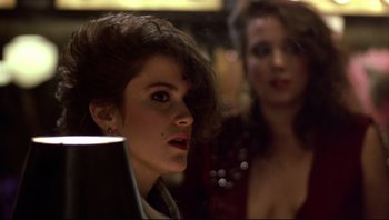 Movie still from “Purple Rain” (1984), directed by Albert Magnoli – Two women are looking into a mirror; Close Up shot, Over the shoulder angle