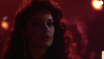 Movie still from “Purple Rain” (1984), directed by Albert Magnoli – A person with long red hair; Close Up shot, Low angle