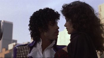 Movie still from “Purple Rain” (1984), directed by Albert Magnoli – A man and a woman are looking into each others eyes; Close Up shot, Low angle