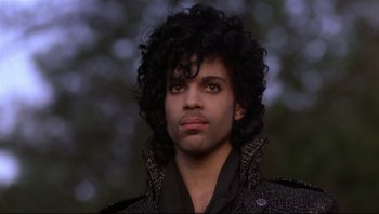 Movie still from “Purple Rain” (1984), directed by Albert Magnoli – A person wearing a jacket; Close Up shot, Low angle