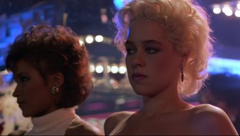 Movie still from “Purple Rain” (1984), directed by Albert Magnoli – A person wearing a white dress; Close Up shot, Over the shoulder angle