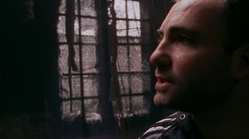 Movie still from “Pusher” (1996), directed by Nicolas Winding Refn – A person looking at something; Close Up shot, Low angle