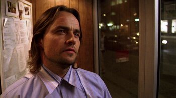 Movie still from “Pusher III” (2005), directed by Nicolas Winding Refn – A person wearing a shirt and tie; Close Up shot, Low angle
