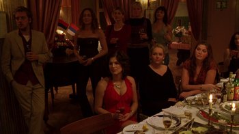 Movie still from “Pusher III” (2005), directed by Nicolas Winding Refn – A group of women sitting at a table with a glass of wine; Wide shot, Over the shoulder angle