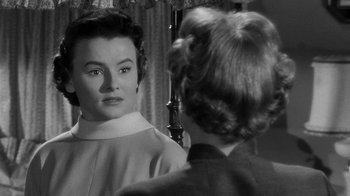 Movie still from “Queen Bee” (1955), directed by Ranald MacDougall – An old photo of a woman looking in the mirror; Close Up shot, Over the shoulder angle