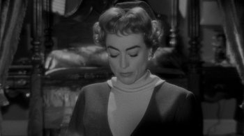 Movie still from “Queen Bee” (1955), directed by Ranald MacDougall – An old photo of a woman looking down at her face; Close Up shot, High angle