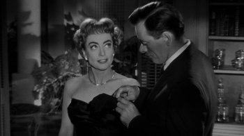 Movie still from “Queen Bee” (1955), directed by Ranald MacDougall – A man and a woman in a black dress; Close Up shot, Over the shoulder angle