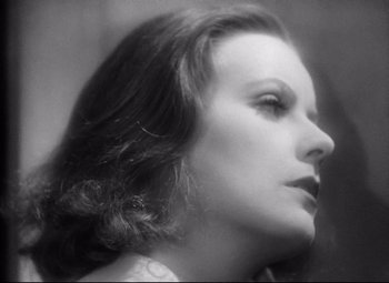 Movie still from “Queen Christina” (1933), directed by Rouben Mamoulian – A black - and - white photo of a woman's face; Close Up shot, Low angle