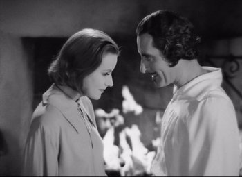 Movie still from “Queen Christina” (1933), directed by Rouben Mamoulian – A man and a woman looking at one another; Close Up shot, High angle