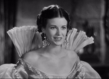 Movie still from “Queen Christina” (1933), directed by Rouben Mamoulian – A black - and - white photo of a woman in a dress; Close Up shot, Low angle