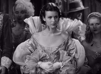 Movie still from “Queen Christina” (1933), directed by Rouben Mamoulian – A black and white photo of a woman in a dress; Medium shot, Low angle