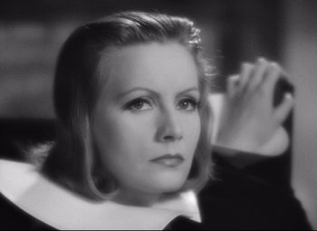 Movie still from “Queen Christina” (1933), directed by Rouben Mamoulian – An old photo of an older woman in a black and white photo; Close Up shot, High angle