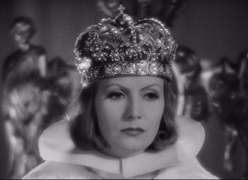 Movie still from “Queen Christina” (1933), directed by Rouben Mamoulian – A black and white photo of a woman wearing a crown; Close Up shot, High angle