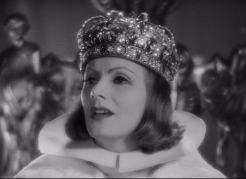Movie still from “Queen Christina” (1933), directed by Rouben Mamoulian – A black and white photo of a woman wearing a crown; Close Up shot, Low angle