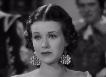 Movie still from “Queen Christina” (1933), directed by Rouben Mamoulian – An old photo of a woman in a black and white photo; Close Up shot, Over the shoulder angle