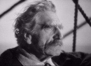 Movie still from “Queen Christina” (1933), directed by Rouben Mamoulian – An old man with a mustache and a beard; Close Up shot, Low angle