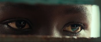 Movie still from “Queen of Katwe” (2016), directed by Mira Nair – View of the eyes of a person; Extreme Close Up shot, Overhead angle
