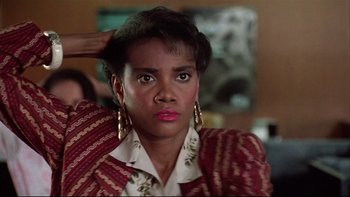 Movie still from “Quick Change” (1990), directed by Howard Franklin – A person wearing a jacket; Close Up shot, Low angle
