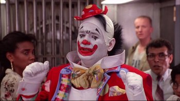 Movie still from “Quick Change” (1990), directed by Howard Franklin – A man dressed up as a clown for a costume party; Close Up shot, Low angle