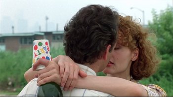 Movie still from “Quick Change” (1990), directed by Howard Franklin – A man and a woman hugging and kissing; Close Up shot, Over the shoulder angle