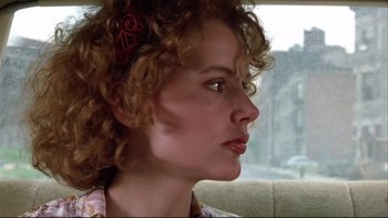 Movie still from “Quick Change” (1990), directed by Howard Franklin – A person sitting on a couch; Close Up shot, Low angle