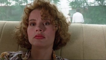 Movie still from “Quick Change” (1990), directed by Howard Franklin – A person sitting in a chair; Close Up shot, Low angle