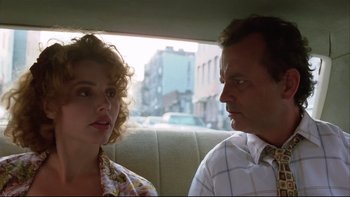 Movie still from “Quick Change” (1990), directed by Howard Franklin – A man and a woman sitting in the back of a car; Close Up shot, Low angle