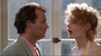 Movie still from “Quick Change” (1990), directed by Howard Franklin – A man and a woman face to face in front of a window; Close Up shot, Low angle