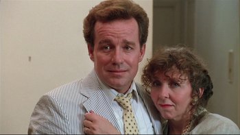 Movie still from “Quick Change” (1990), directed by Howard Franklin – A man and a woman pose for a picture; Close Up shot, Low angle